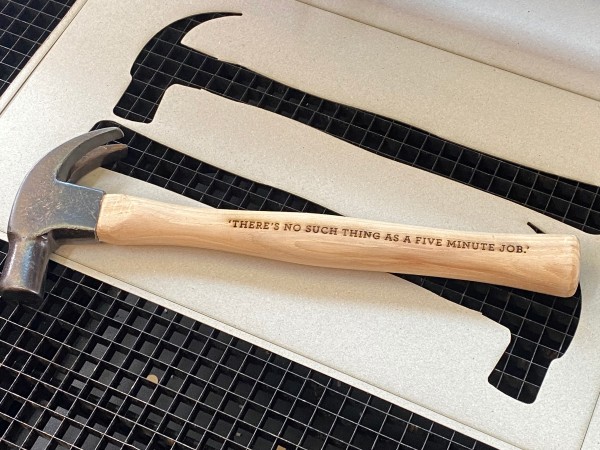 engraved quotes on a hammer with foam insert